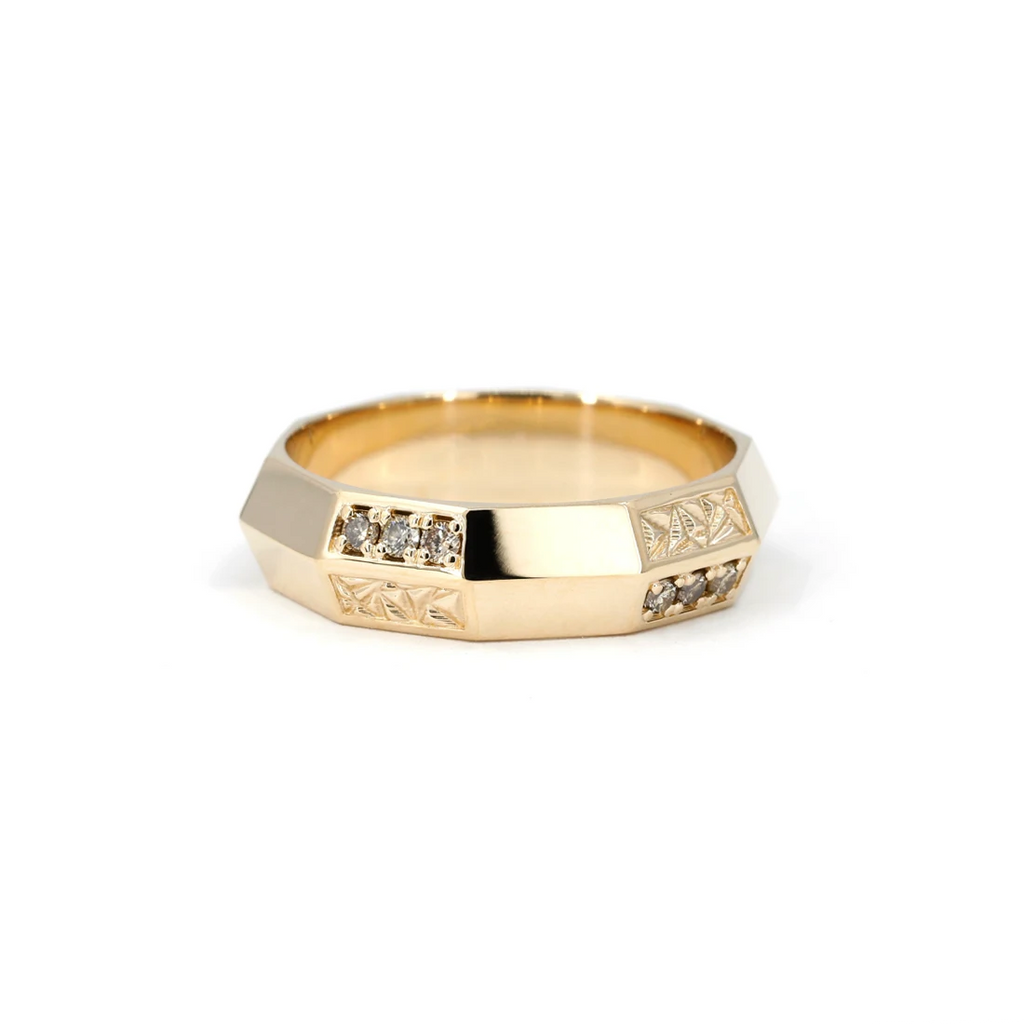 Designer wedding band featuring 15 small brown diamonds and a chiseled texture, handcrafted in Montreal by independent brand Bena Jewelry. This band is made to order and available at Ruby Mardi, the best jewelry store in Montreal.