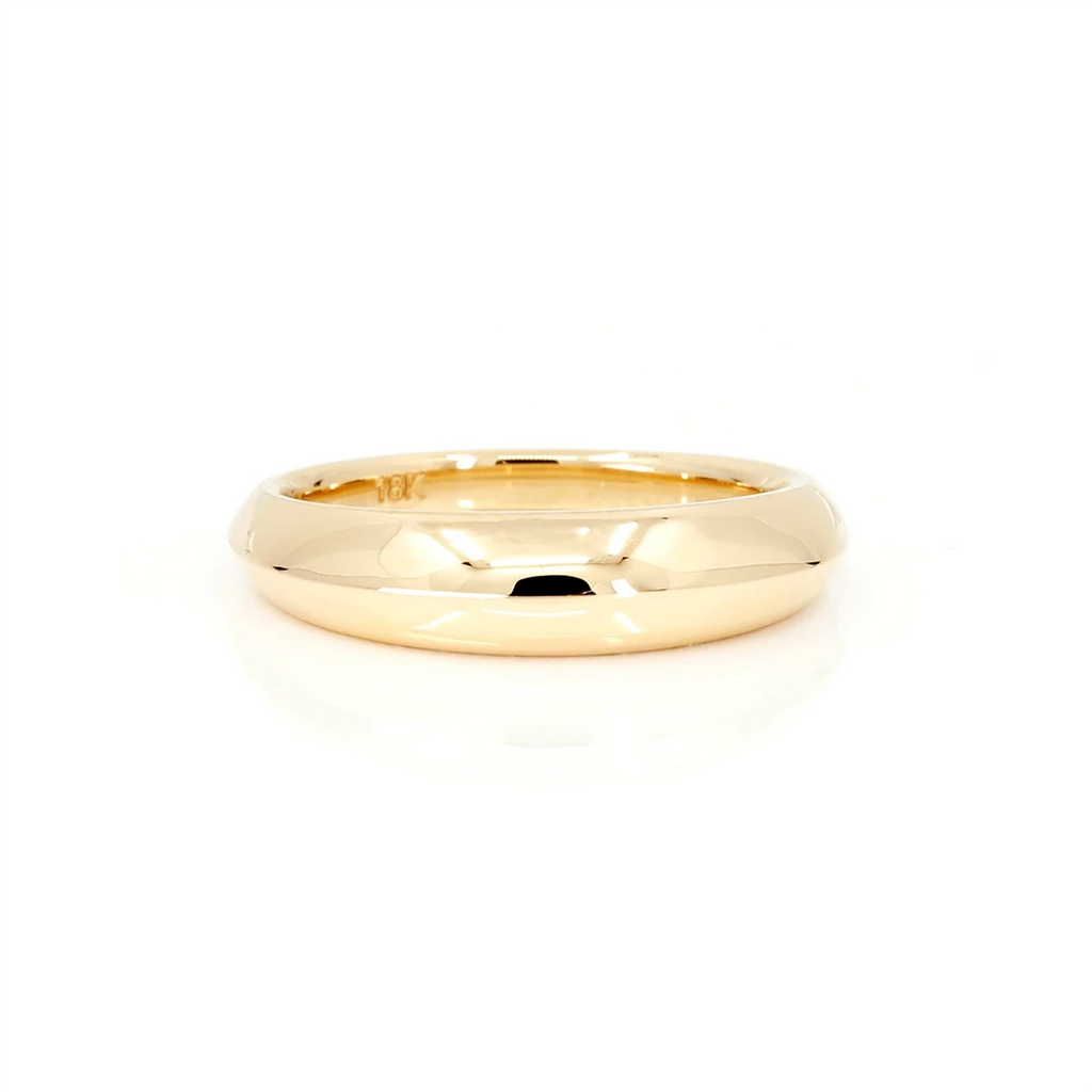 This splendid wedding band is made in yellow gold at our Montreal studio, available in several sizes this wedding ring for men is classic a small dome to give it a modern touch. This fine piece of jewelry is available for sale at the Ruby Mardi jewelry store specializing in unique creations by Canadian artisan jewelers.