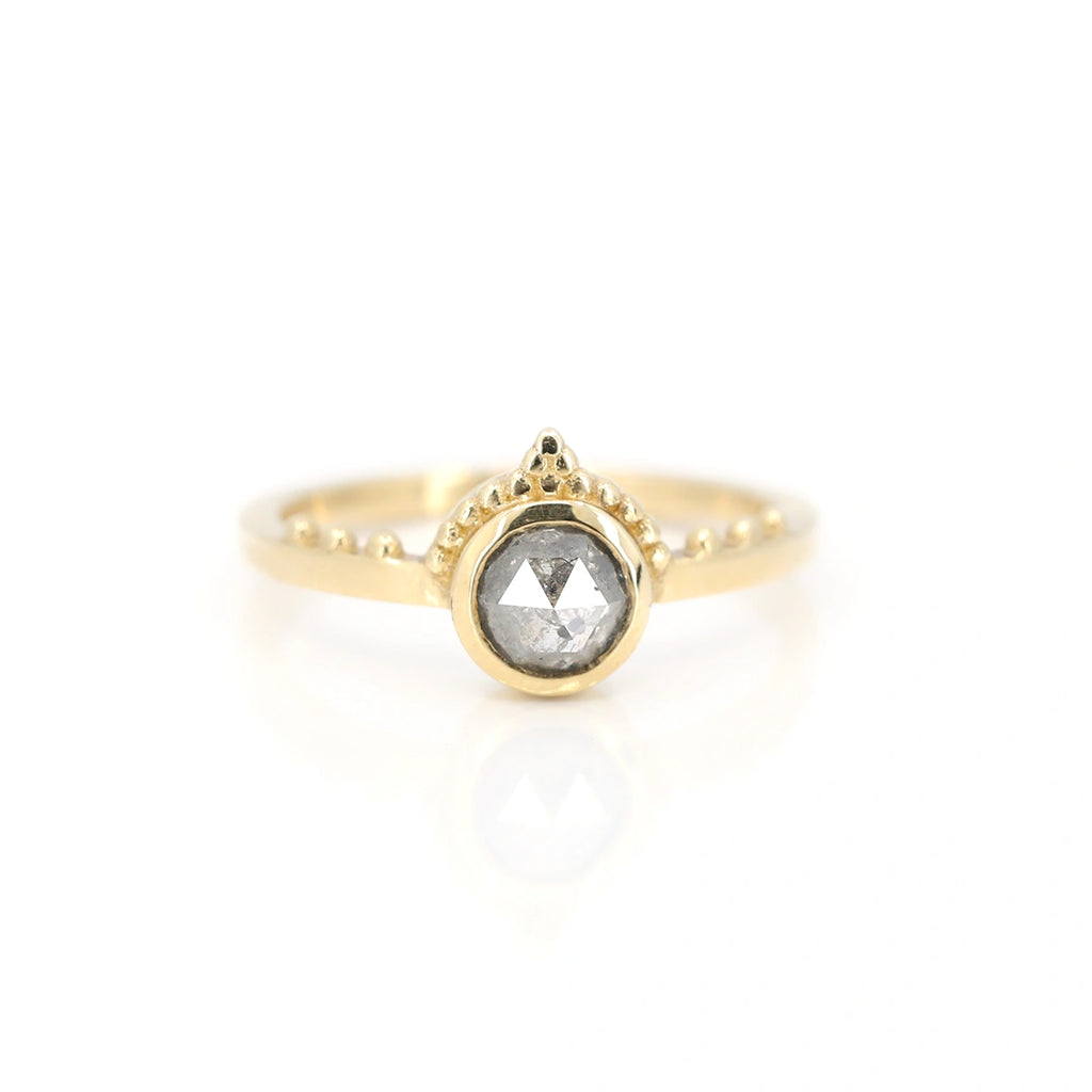 Yellow gold round rose cut salt and pepper diamond handmade in Canada by Arasaeus Design. One-of-a-kind alternative engagement ring seen on a white background, available at fine jewellery store Ruby Mardi, in Montreal’s Little Italy.