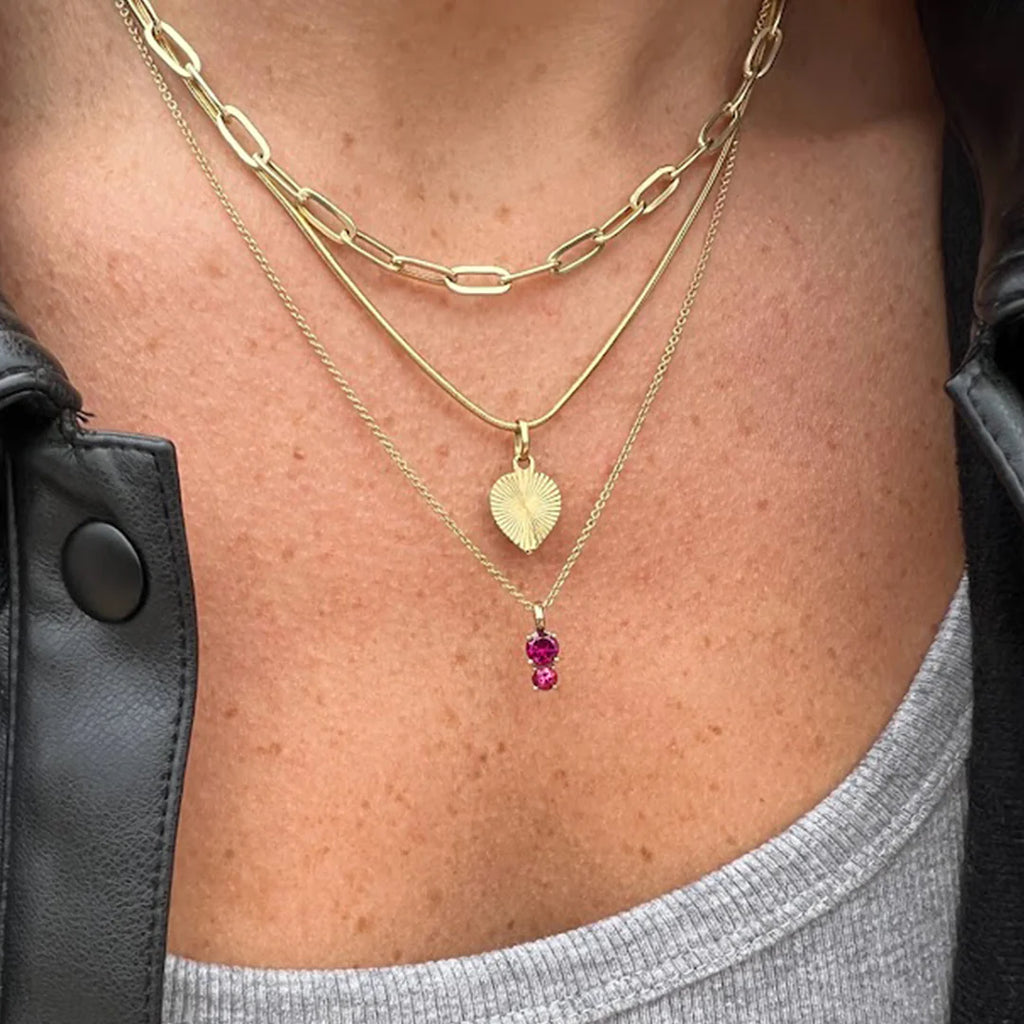 girl wearing two tourmaline gemstone yellow gold pendant cusotm made in montreal everyday fine jewels by ruby mardi designers lico jewelry and other gold chains