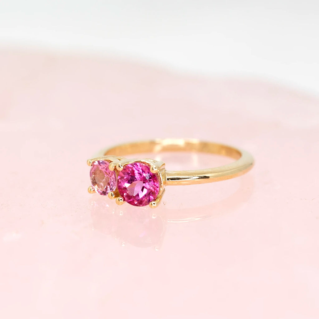 side view of pink tourmaline custom made ring in montreal at the best jewelry store in canada finest designer boutique ruby mardi on a pink background