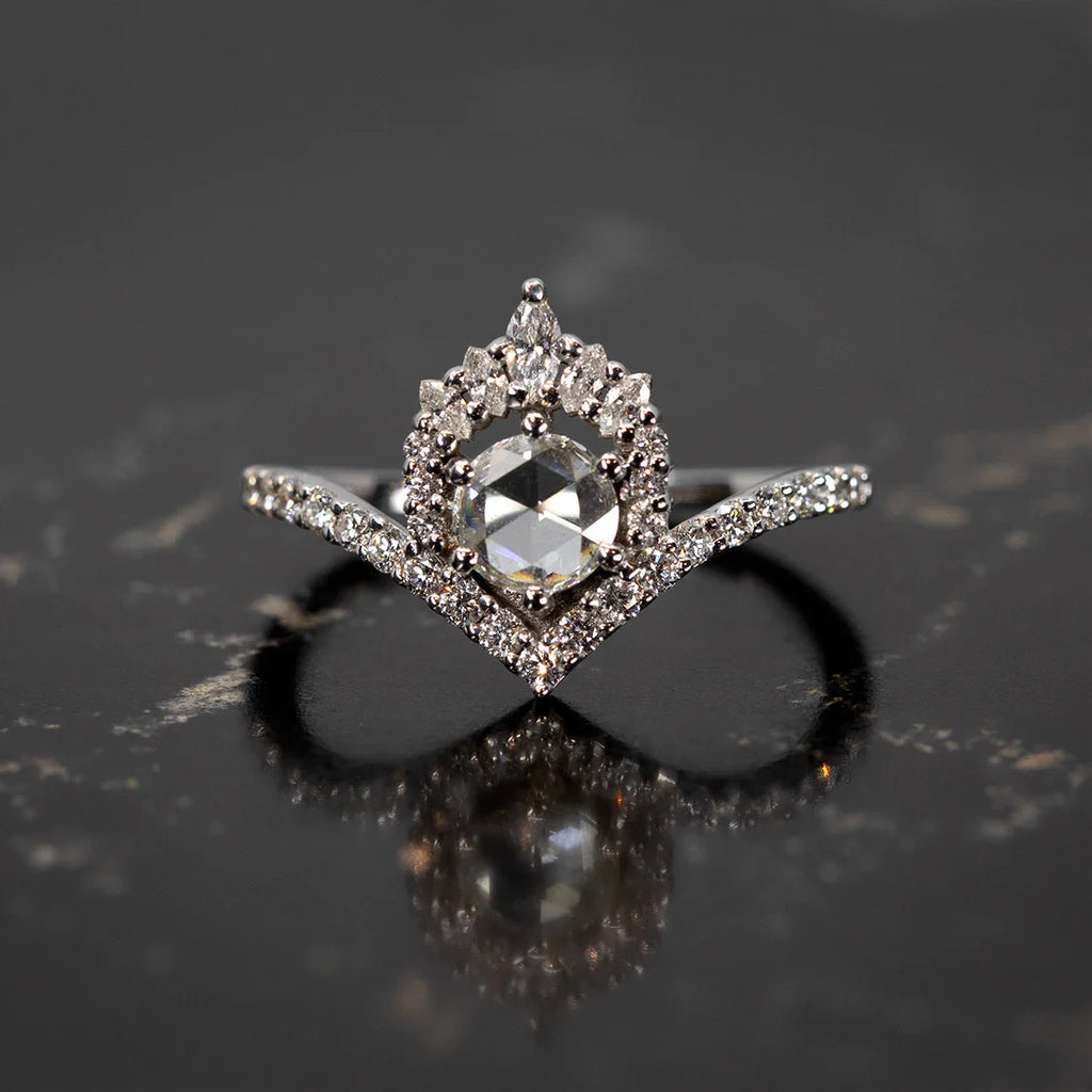 14k white gold engagement ring with rose-cut diamond and double halo, displayed on black marble surface. Designed by Anastassia Sel for Ruby Mardi, Montreal.
