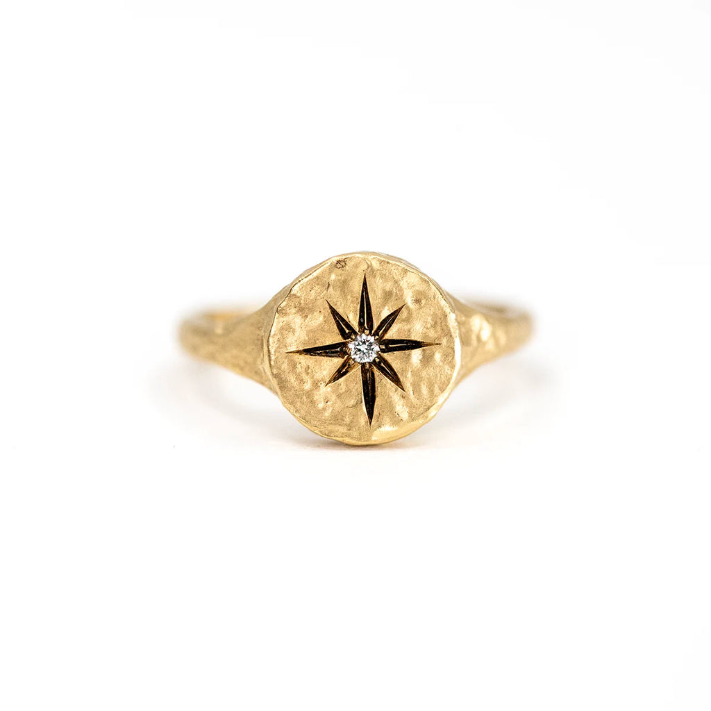 Handmade 14k gold hammered ring by Anouk Jewelry featuring a unique inner compass design and a natural 0.07 ct diamond. A one-of-a-kind (OOAK) artisan piece exclusively available at Ruby Mardi, the premier jewelry store in Canada.