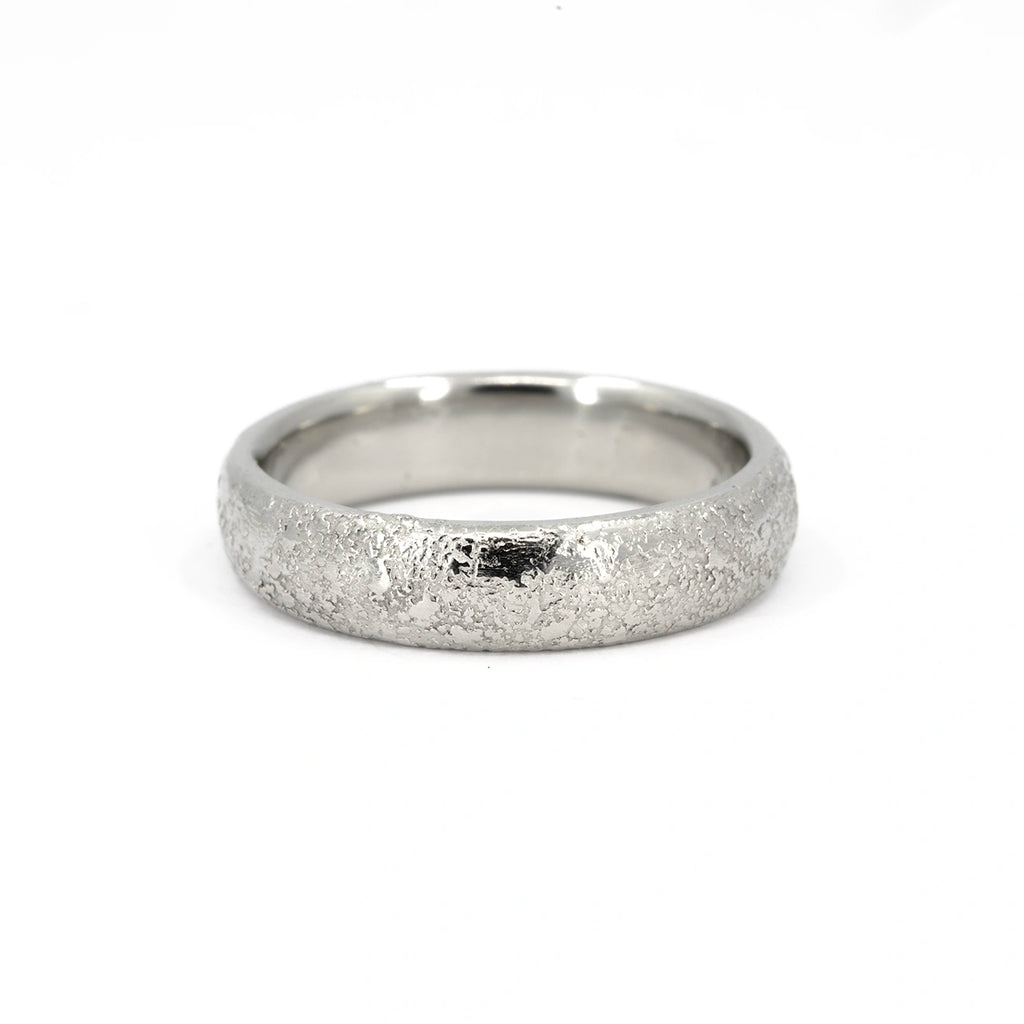 Textured white gold wedding band with a domed profile and polished interior, 5mm wide, handcrafted in Canada by Fluid Jewellery, available at Ruby Mardi.