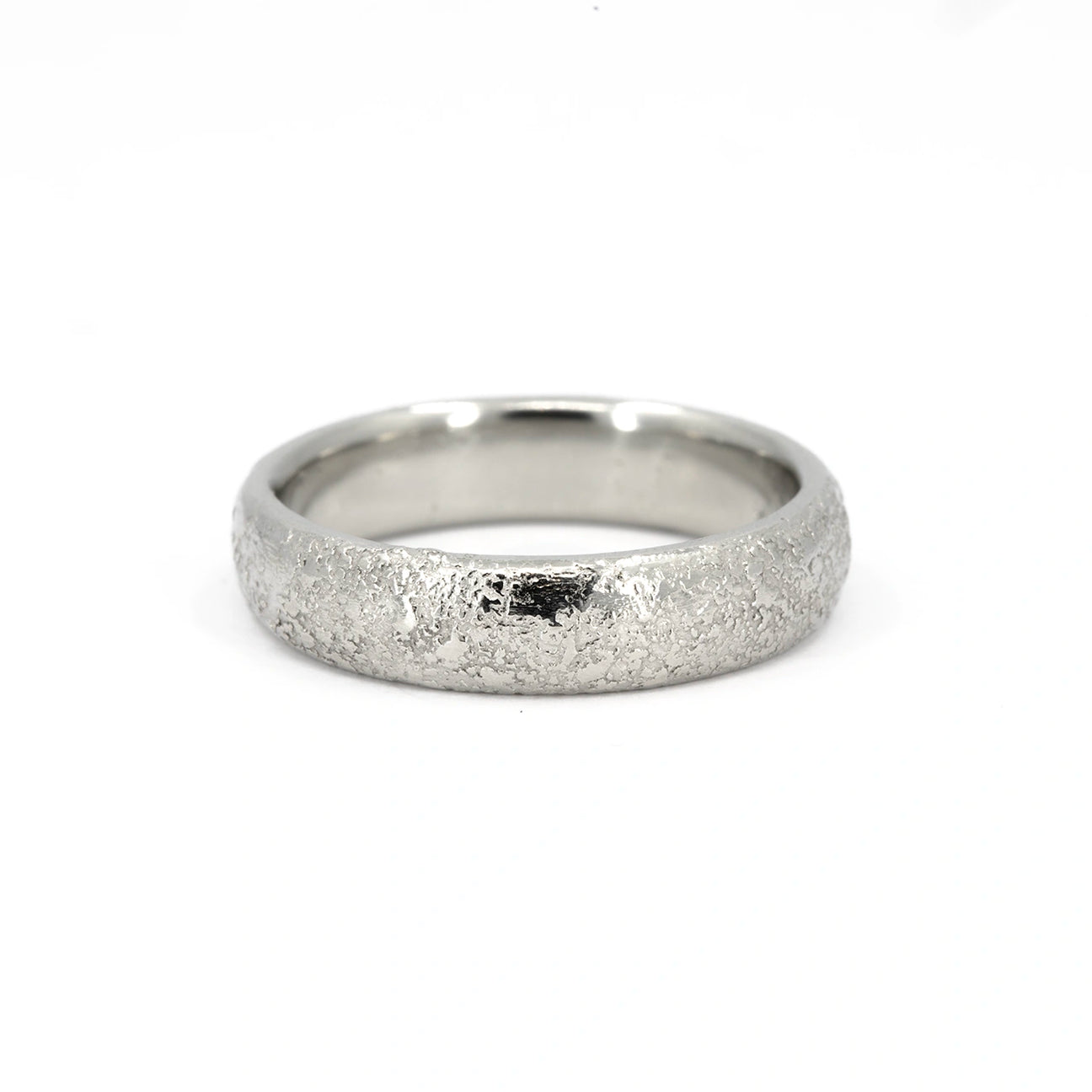 Textured white gold wedding band with a domed profile and polished interior, 5mm wide, handcrafted in Canada by Fluid Jewellery, available at Ruby Mardi.