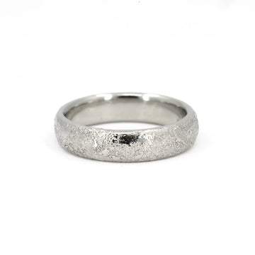 Textured white gold wedding band with a domed profile and polished interior, 5mm wide, handcrafted in Canada by Fluid Jewellery, available at Ruby Mardi.