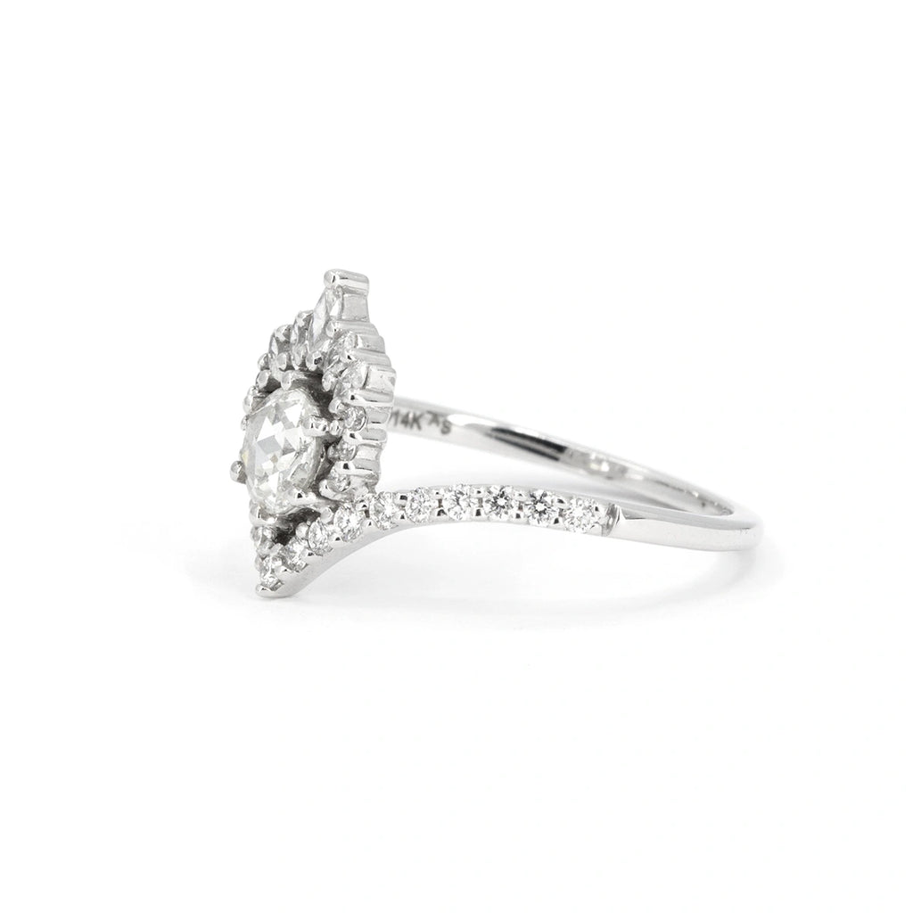 Side view of 14k white gold engagement ring with rose-cut natural diamond, intricate double halo and pavé band. Designed by Anastassia Sel, sold at Ruby Mardi, Montreal, Canada.