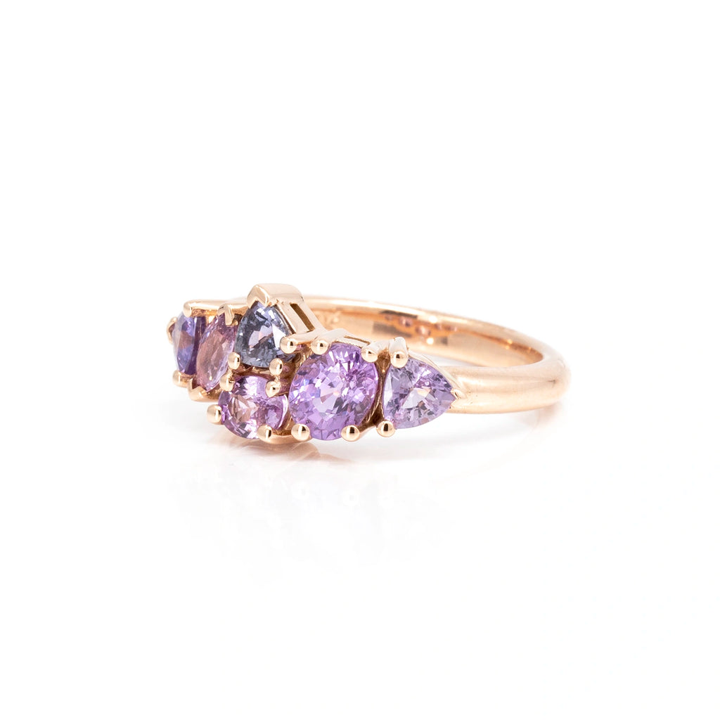Side view on a white background of a gemstone ring featuring 6 natural sapphires. This ring was handcrafted in Montreal for jewelry store Ruby Mardi.