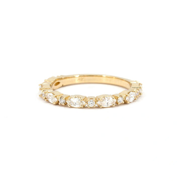 A delicate yellow gold wedding band adorned with marquise and round diamonds, known as “Shimmer Whisper,” reflecting a soft, radiant sparkle. Crafted in Montreal, Canada, by independent jewelry brand Ruby Mardi.