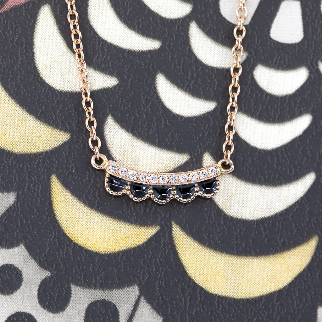 Ruby Mardi fine jewelry – 14k rose gold necklace by Emily Gill featuring a curved scallop detail in black enamel, accented with subtle natural diamonds. Elegant designer pendant available at Ruby Mardi.