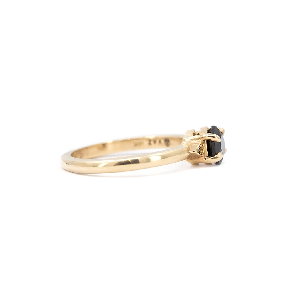 Side profile of the Luna Hex black spinel and champagne diamond ring by Liane Vaz for Ruby Mardi, showing the prong setting and tapered yellow gold band.