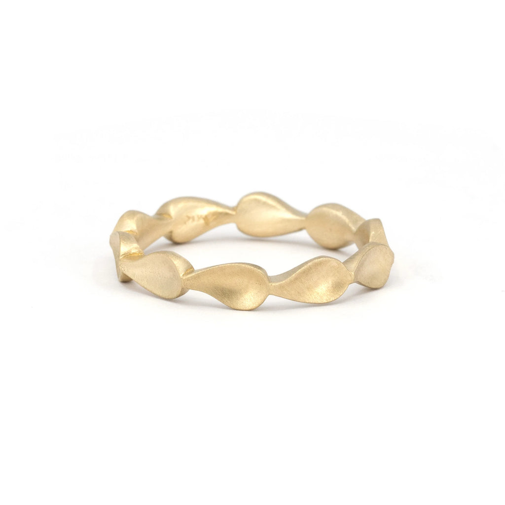 Gold bangle with a sand blast finish is a bridal bangle with a small wave style. Made in Canada by Fluid Jewelry, independent designer.