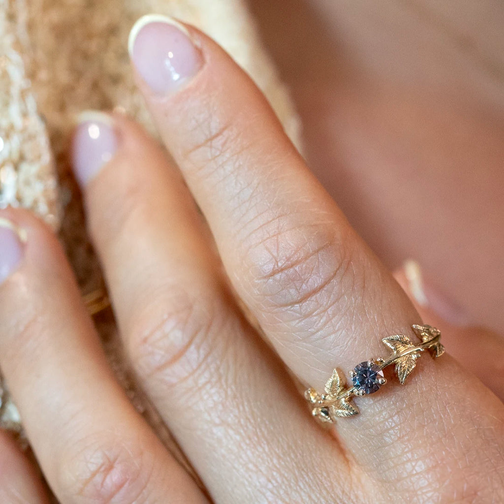 Champagne diamond engagement ring with nature-inspired gold band featuring leaf details, worn on a hand – Ruby Mardi Montreal, Meg Lizabet Jewelry.