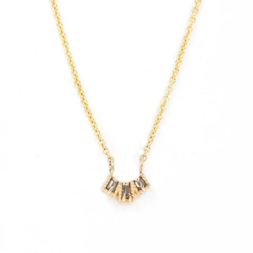 Champagne diamond baguettes necklace designed and handcrafted by Nadia Werchola for Canadian jewelry store Ruby Mardi. Delicate yellow gold necklace photographed on a white background.