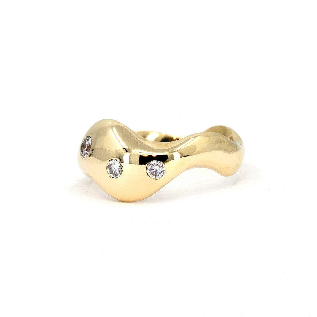 High-polish 10k yellow gold wave ring with three round lab-grown diamonds, featuring bold organic curves. Designed by Marni Bree, available at Ruby Mardi in Montreal.