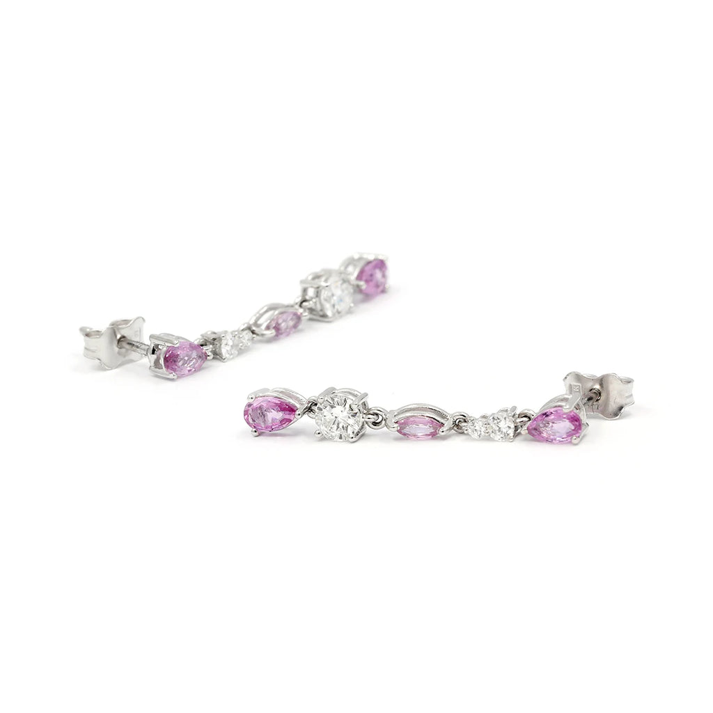 Montreal's independent jewelers VCL presents drop earrings with pear-shaped pink sapphires and diamonds. Mounted on white gold, this splendid piece of fine jewelry is made in Canada. Available for sale at the Ruby Mardi jewelry store.
