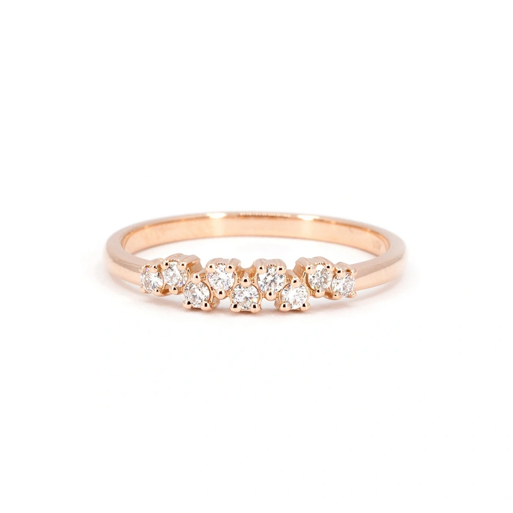 Rose gold wedding band featuring an elegant row of round diamonds in an alternating high-low alignment. A modern design crafted by Ruby Mardi in Montreal.
