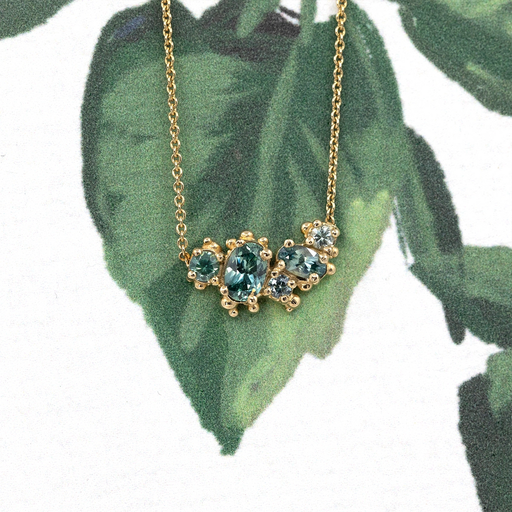 Cluster necklace with Montana sapphires set in 14k yellow gold, handcrafted by Canadian designer Meg Lizabet. Available at Ruby Mardi jewelry boutique in Montreal, Canada.