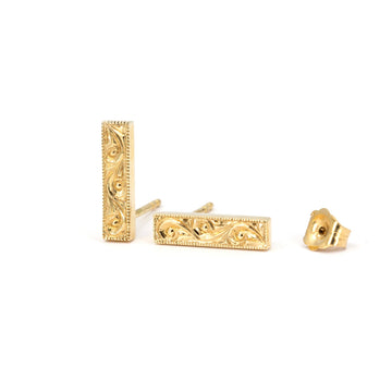 Rectangular gold stud earrings with intricate scroll engraving and milgrain edges, Art Deco-inspired design by Deborah Lavery for Ruby Mardi, photographed on white.