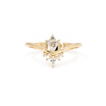 Asymmetrical 14k gold ring with trillion, pear, and round diamonds, designed by Oleg Leybman. Studio shot on white background. Available at Ruby Mardi in Montreal.