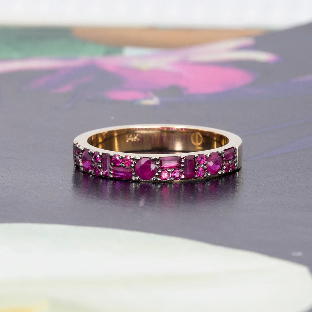 This front view of the pink ruby ring made in yellow gold with black rhodium by Canadian jewelry designer Oleg Leybman in collaboration with Ruby Mardi, the best jewelry store in Montreal. This unusual and delicate bridal ring is handcrafted by ethical artisan jewelers.