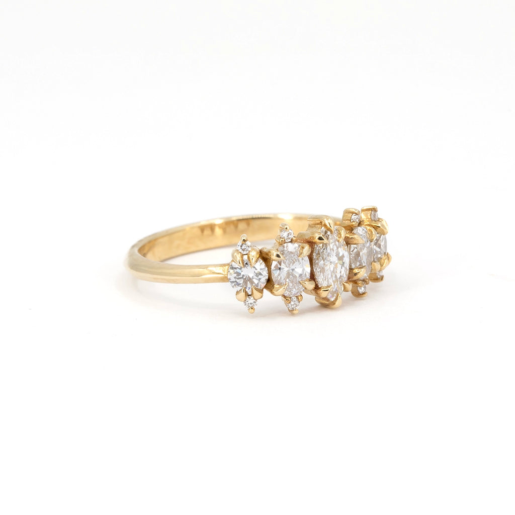 Diamond ring by Canadian jeweller Nadia Werchola, crafted in 10k yellow gold with a cluster of round lab-created diamonds. Photographed on a clean white background to highlight the textured prongs and organic silhouette.
