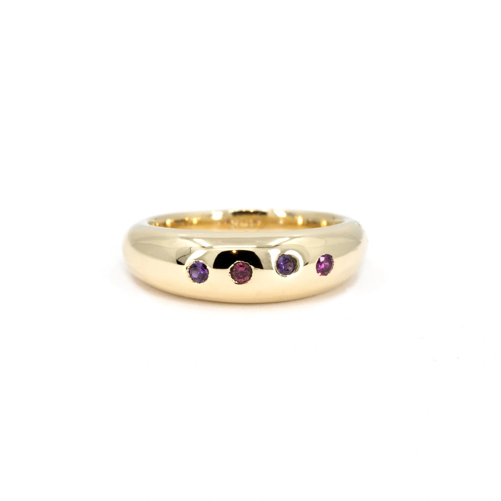 Chunky dome ring in yellow gold with flush-set natural sapphires in purple and pink tones, handmade by Marni Bree in British Columbia, available at Ruby Mardi.
