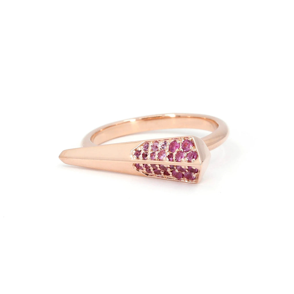 The pink sapphires of the Spine ring are set in yellow gold with an edgy and dynamic style. This fine piece of jewelry is made by Canadian jewelry designer Bena Jewelry and manufactured in Montreal. The ring is part of the Fancy Edgy collection and is available for sale or for presentation at the Ruby Mardi jewelry store and gallery located in Montreal.