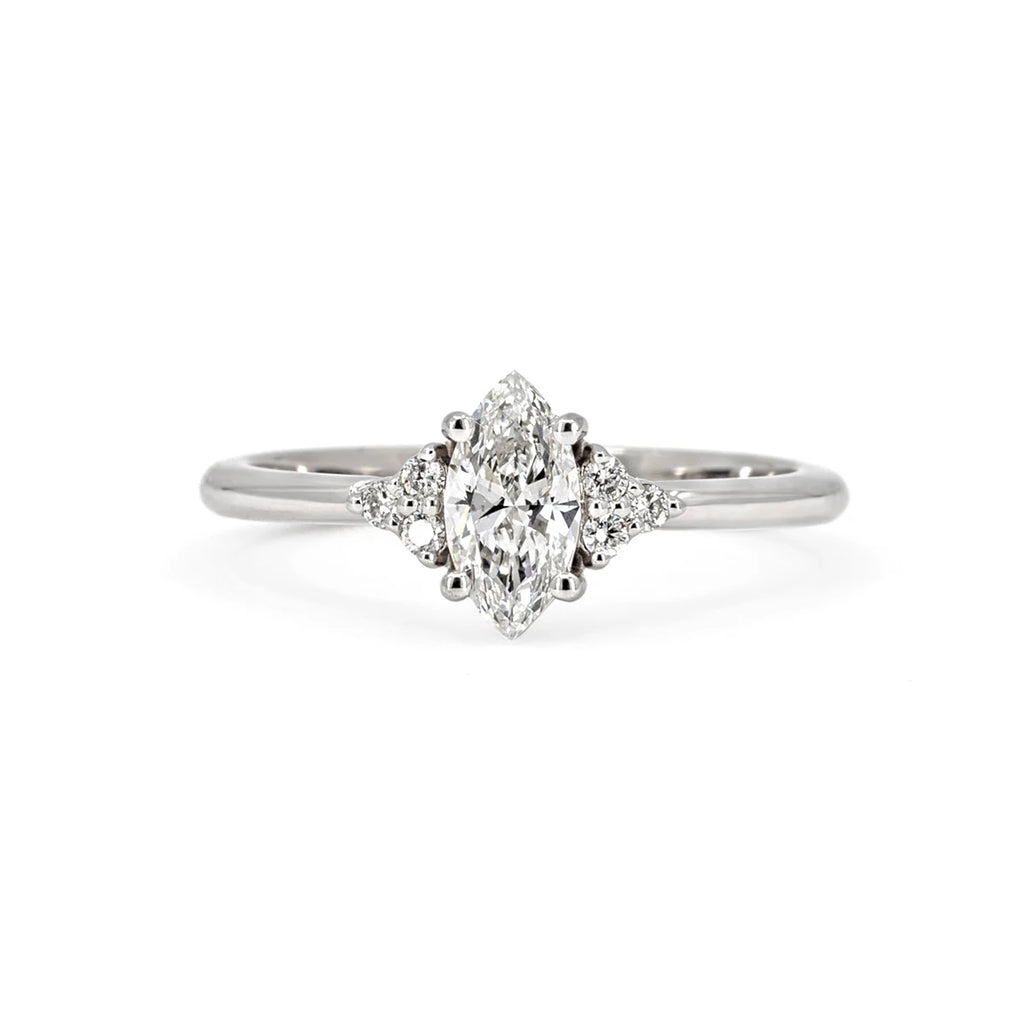 Classic engagement ring featuring a marquise lab-grown diamond with delicate side diamond accents, set in polished white gold. Part of Ruby Mardi's Classic Jewelry collection, designed and crafted in Montreal.