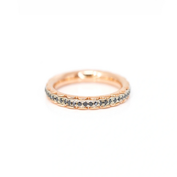 Eternity wedding ring made by the jewelry designer Janine de Dorigny made in pink gold and white gold with black diamonds. This delicate and very original ring is perfect as a wedding band or as a stacking ring. Available at Ruby Mardi Jewelry, a fine Canadian designer jewelry gallery.