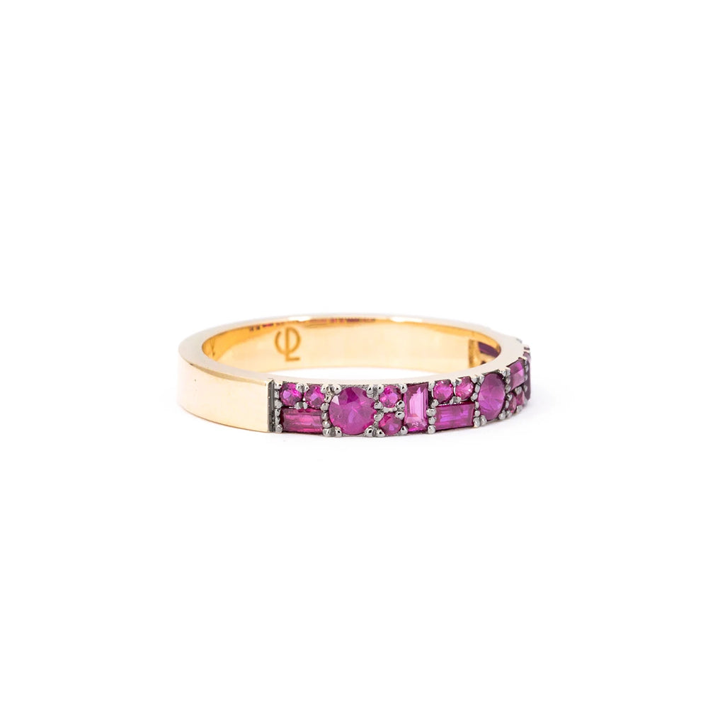 This yellow gold wedding band with multi-shaped rubies is made by independent jewelry designer Oleg Leybman in Canada. Made to the highest standard of quality, this bridal ring is available for sale at the Ruby Mardi jewelry store, which specializes in one-of-a-kind engagement rings.