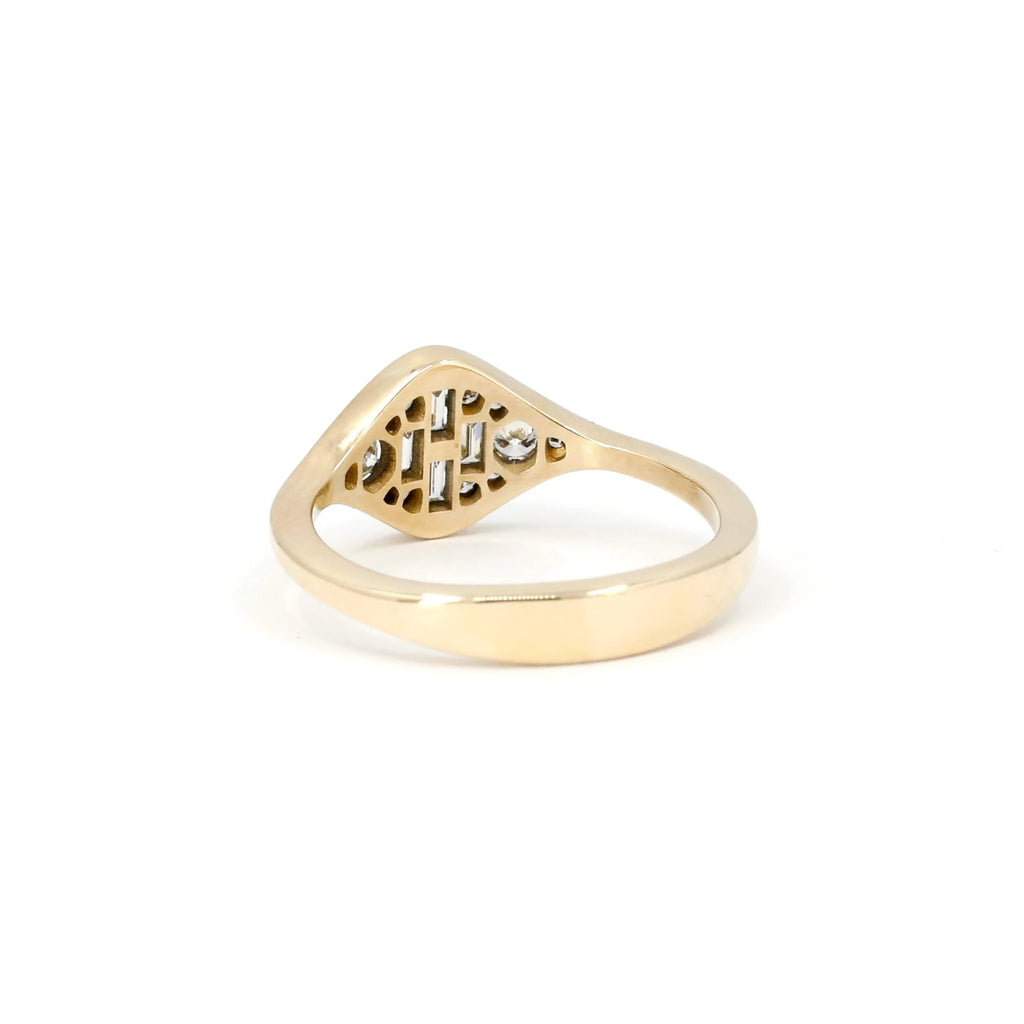 This yellow gold ring is handmade by independent Canadian jewelry designer Oleg Leybman. This bridal jewelry is a one-of-a-kind custom creation and is on sale at the Ruby Mardi jewelry store which represents Quebec and Canadian jewelry artisans.