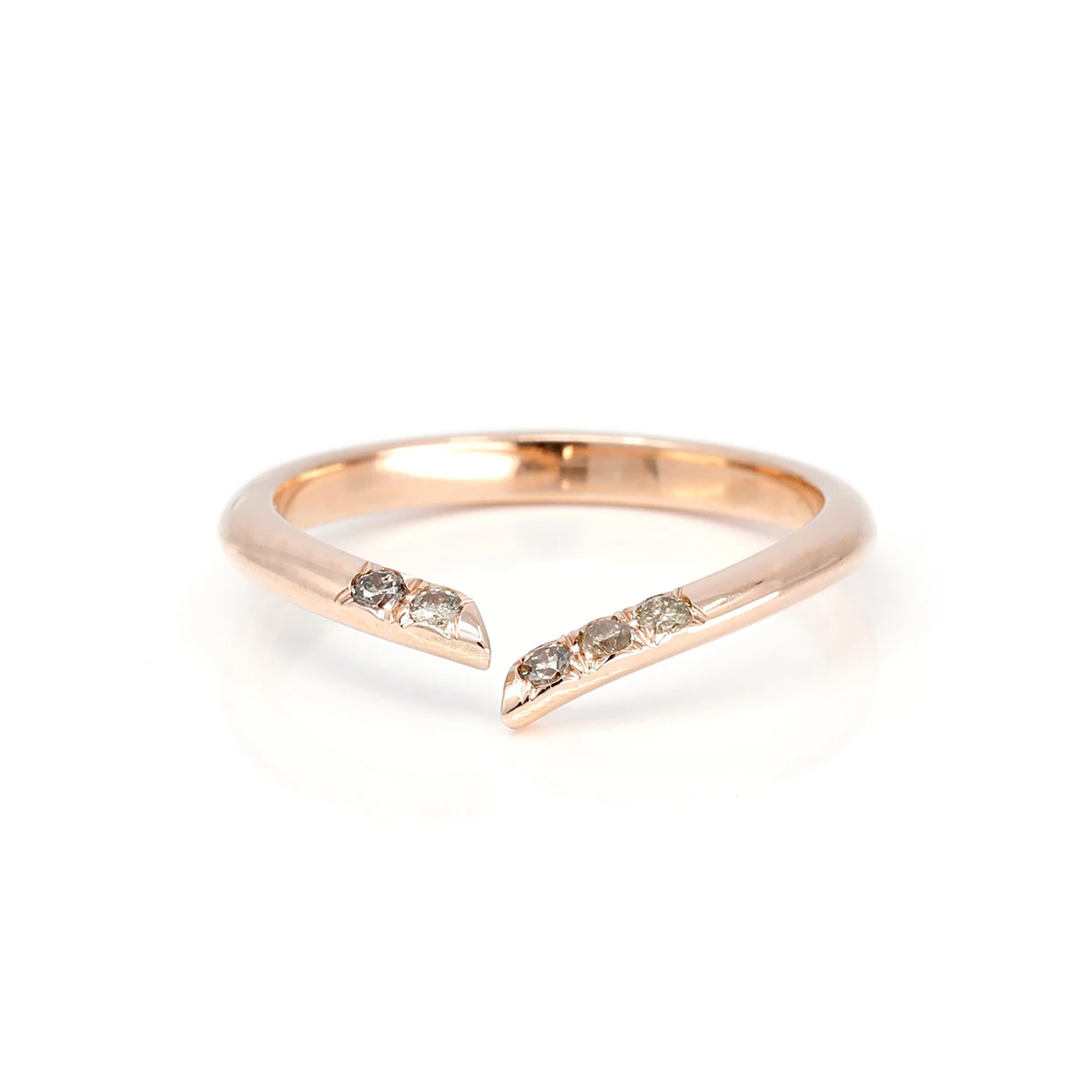 Open wedding band photographed on a white background. The ring is made of rose gold and shows 5 natural golden brown diamonds on the band. 