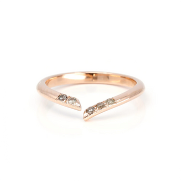 Open wedding band photographed on a white background. The ring is made of rose gold and shows 5 natural golden brown diamonds on the band. 