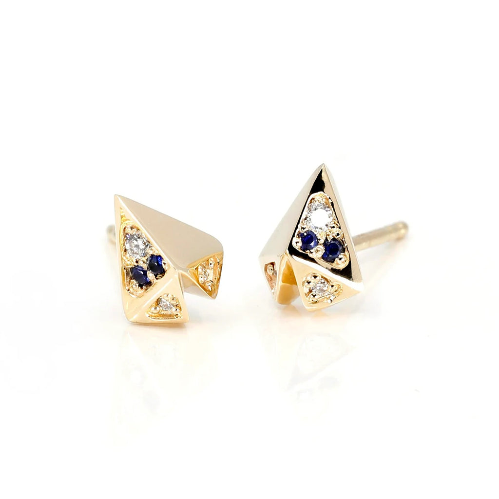 These edgy little sharp heart-shaped studs are made by the Canadian indie jewelry designer in collaboration with Montreal's Ruby Mardi jewelry store. Made with small sapphire and round diamonds this earrings is unisex and modern. Made in Canada by Bena Jewelry.