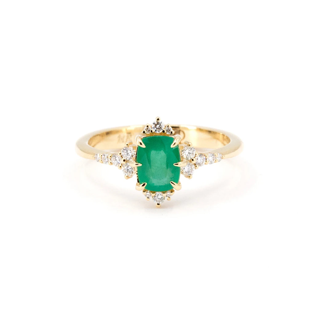 Oleg Leybman presents this engagement ring with a cushion emerald and fine prongs and round diamonds arranged in an original way for an alternative bridal ring made by an independent Canadian jeweler. This one-of-a-kind fine piece of jewelry is available for sale at Ruby Mardi, a local jewelry store and designer jewelry gallery, located in Montreal.