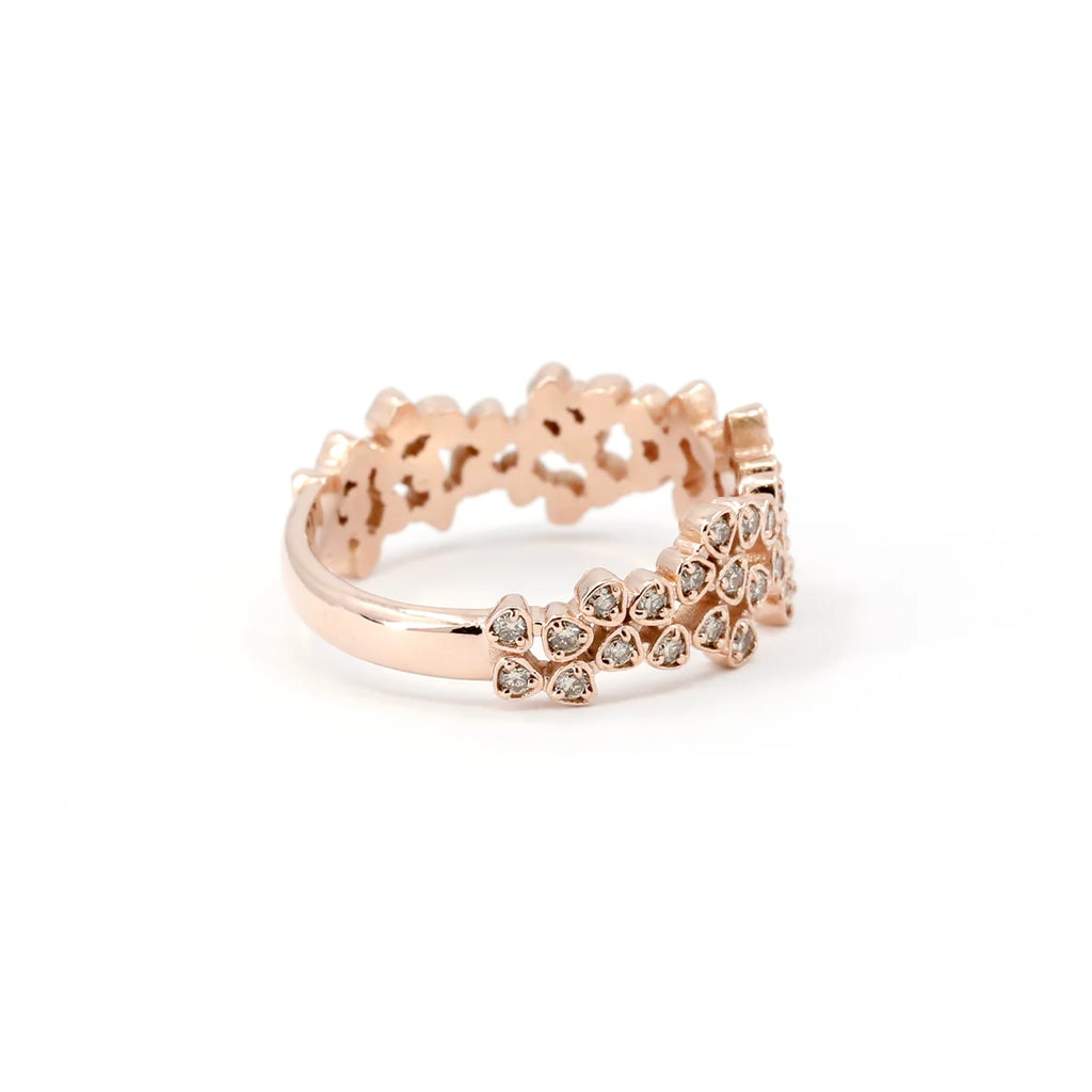This rose gold ring with small brown or champagne-colored diamonds is handmade by artisan jeweler Oleg Leybman, specialist in alternative fine rings and one-of-a-kind bridal jewelry, made in Canada. This fine jewelry is available for sale at the Ruby Mardi jewelry store, located in Montreal in the heart of Little Italy.