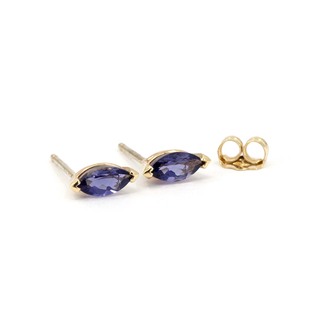 10k yellow gold stud earrings featuring natural marquise-cut iolites, displayed on a white background with gold posts and backs, available at Ruby Mardi in Montreal.