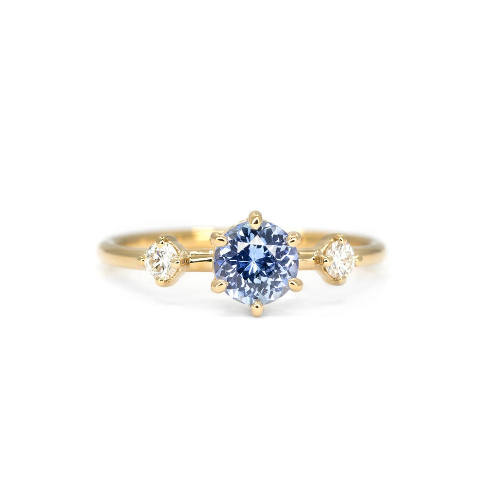 Light blue sapphire and diamond engagement ring in yellow gold, handmade by Maksym Jewelry in Montreal. Available at Ruby Mardi.