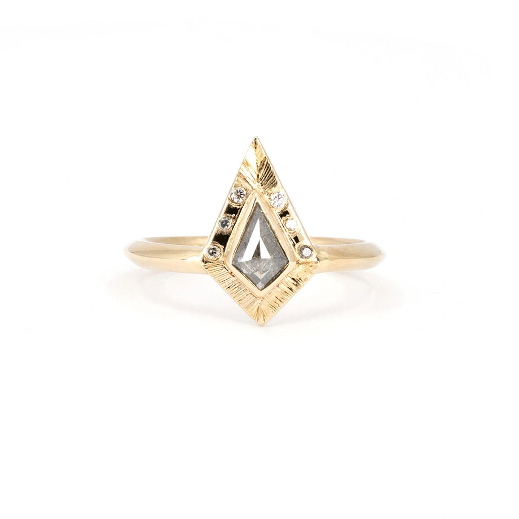 Unique engagement ring in yellow gold, with a central salt-and-pepper kite-shaped diamond and diamond accents. Handcrafted by independent Canadian brand Rebel & Rogue. Available at Ruby Mardi, the coolest jewelry store in Canada.