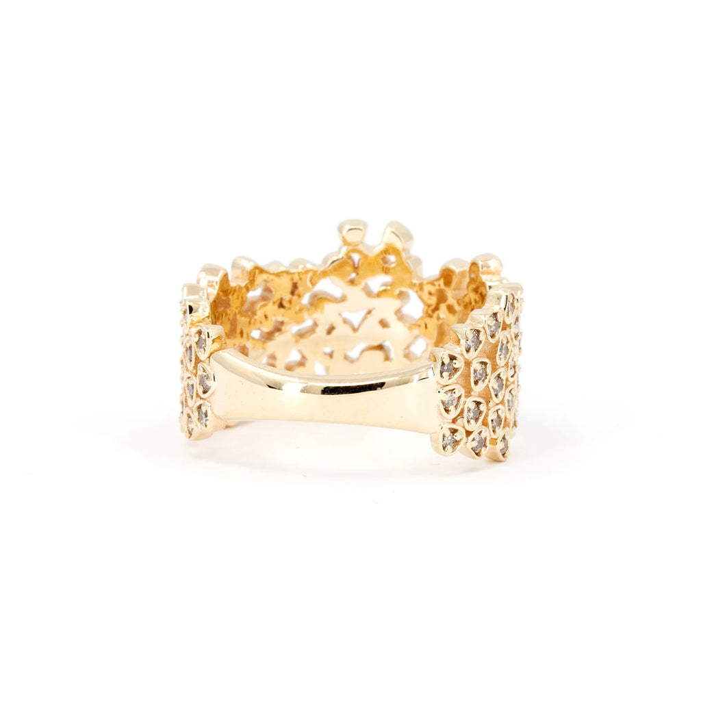 This rear view of Oleg Leybman's Lace ring is yellow gold with numerous small champagne-colored diamonds in a bezel setting and showcases the meticulous work of this independent Canadian artisan jeweler. This ring is available for sale at Ruby Mardi jewelry store specializing in one-of-a-kind engagement rings and delicate bridal jewelry.