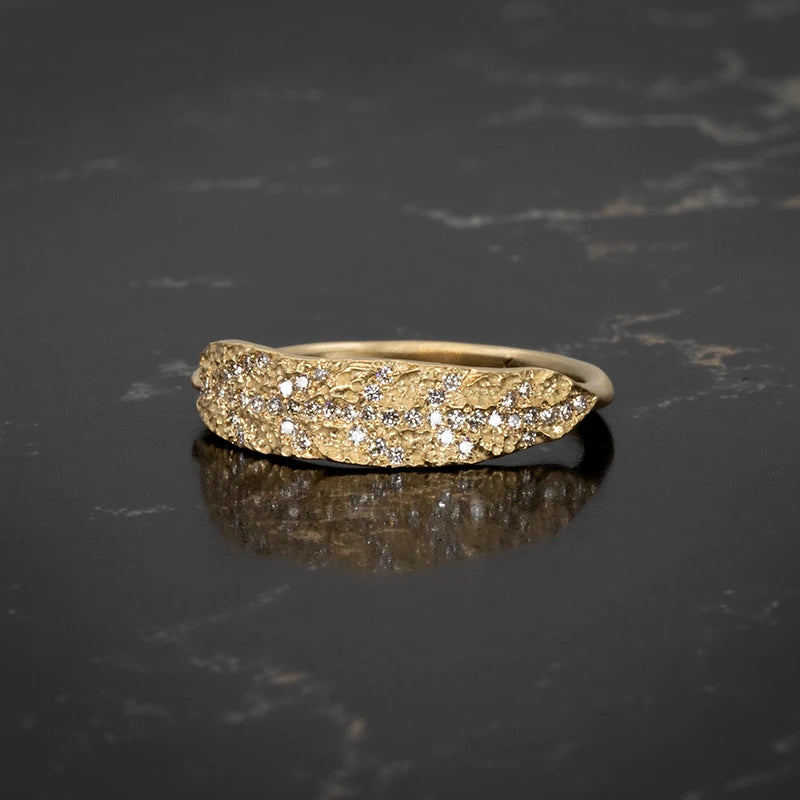 Leaf-inspired textured gold ring with pavé-set white diamonds, handcrafted by Canadian designer Caelen Ellis of Fluid Jewellery. Available at Ruby Mardi in Montreal.