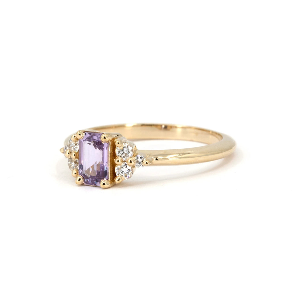 Lavender sapphire engagement ring in 14k yellow gold, accented with round brilliant diamonds. A refined and luminous design by Alessandra Pompei, available at Ruby Mardi.