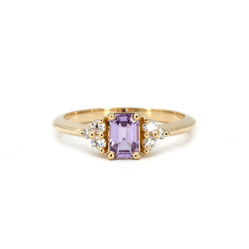 Lavender sapphire engagement ring set in 14k yellow gold, accented by round brilliant diamonds. Designed by Alessandra Pompei, available exclusively at Ruby Mardi.