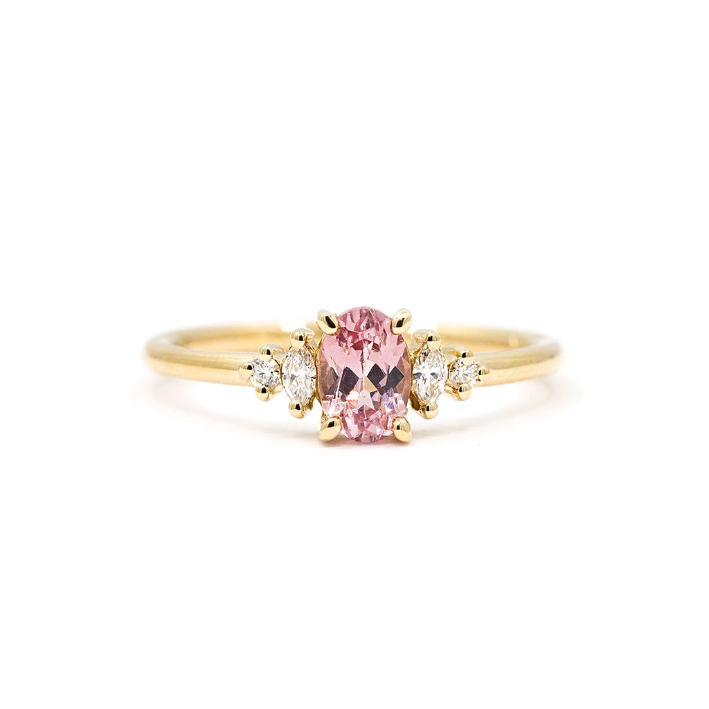 Malaya garnet engagement ring in yellow gold with side diamonds, handmade by Maksym in Montreal, available at Ruby Mardi, artisan jewelry store in Canada.