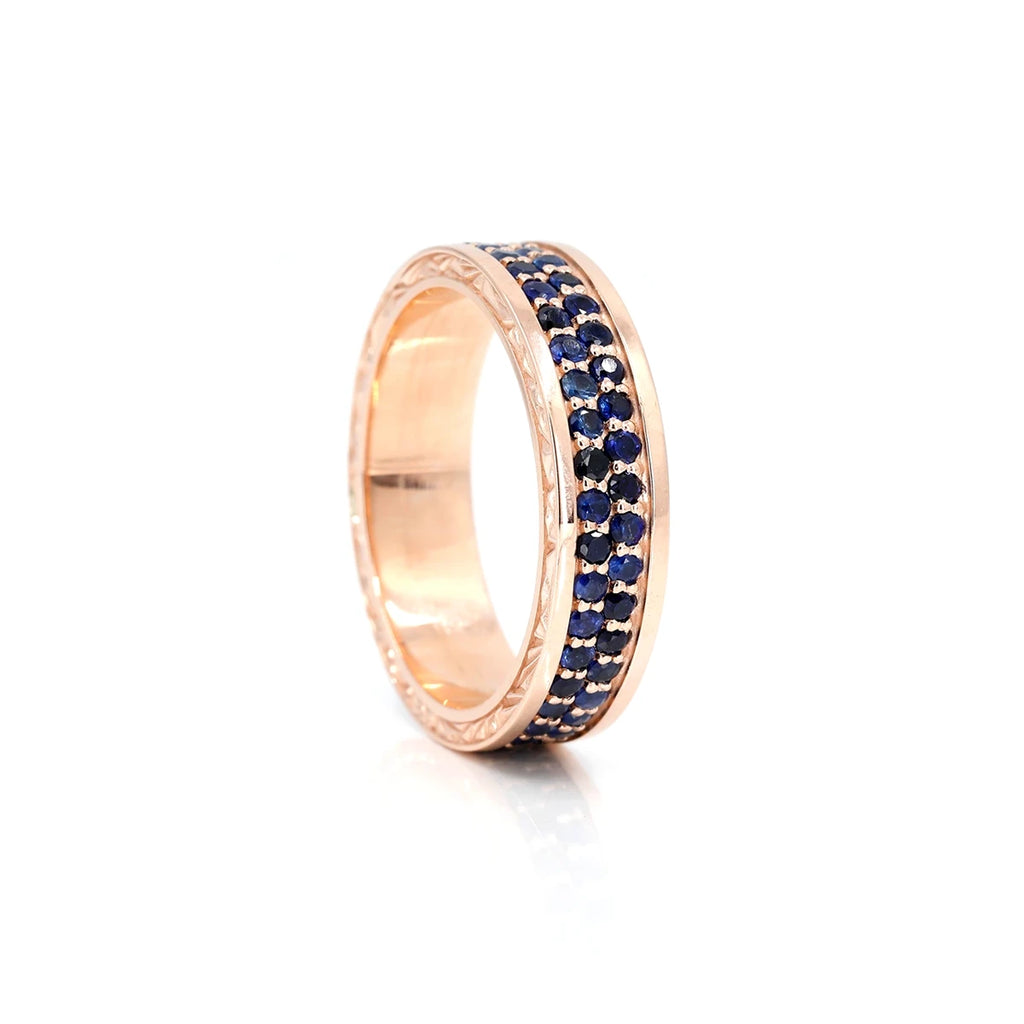 Unique men's ring in rose gold with royal blue sapphires. This edgy wedding ring is made in Canada by independent jewelry designer Bena Jewelry, and is available at upscale jewelry store Ruby Mardi, in Montreal’s Little Italy. We ship our high-end jewellery to the USA as well.