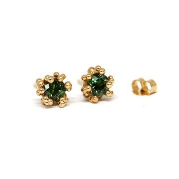 Yellow gold Baleal gemstone earrings with gold granules and ethical green sapphire from Montana by Toronto-based jewelry designer Meg Lizabet. Organic handmade earrings with hand-placed gold granules. 14K yellow gold earrings, original organic fine jewelry piece. Find Meg Lizabet's creations in Montreal at Ruby Mardi, a boutique-gallery in Montreal's Little Italy, not far from Rosemont, Villeray, Outremont, Mile End. Custom jewelry design services in Montreal also available.
