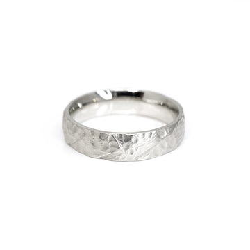 white gold men wedding band made in montreal by local artisan designer at jewelry boutique ruby mardi bespoke jewellery designer on a white background