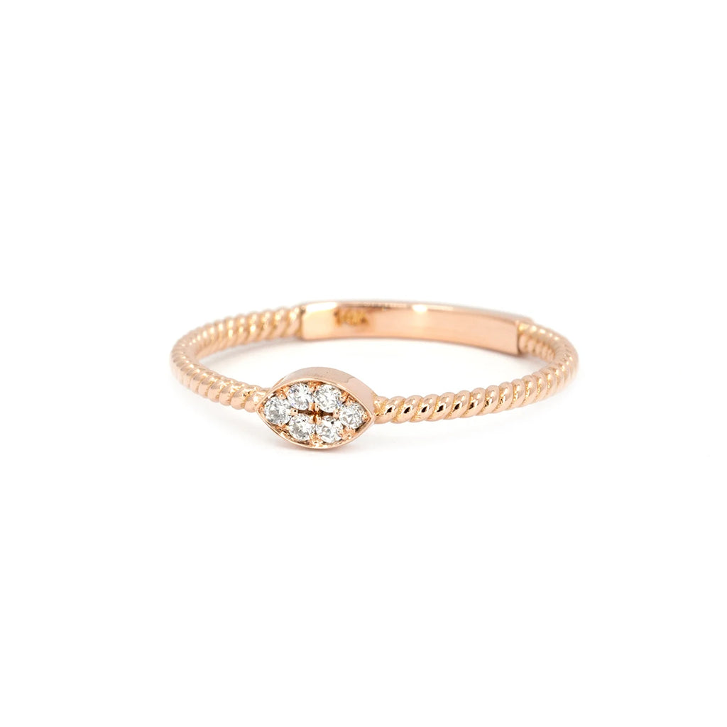 Minimalist rose gold ring with twisted band and marquise-shaped cluster of natural white diamonds. Designed by Oleg Leybman and handcrafted in Toronto. Available at Ruby Mardi, Montreal.