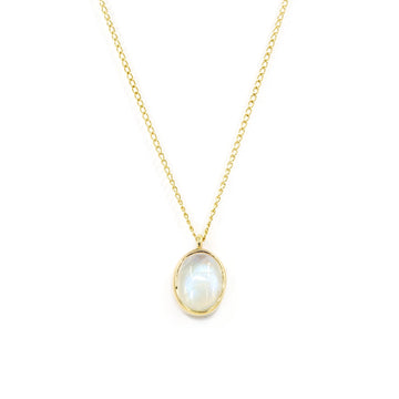 Classic yellow gold 10k pendant featuring an oval cabochon moonstone, bezel set. Handcrafted by Rooz Jewelry and available at Ruby Mardi, this elegant piece is the perfect gift for those born in June, as moonstone is their birthstone.